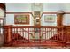 Elegant staircase with a curved wooden railing and hardwood floors at 3015 3Rd St, Boulder, CO 80304