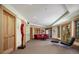 Basement sitting area with a red couch and access to an outdoor patio at 3015 3Rd St, Boulder, CO 80304