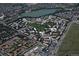 Aerial view of community showing buildings, landscaping, and lake at 690 S Alton Way # 1C, Denver, CO 80247