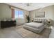 Bright bedroom with a large window and neutral color palette at 690 S Alton Way # 1C, Denver, CO 80247
