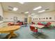 Community card room with card tables and chairs at 690 S Alton Way # 1C, Denver, CO 80247