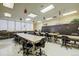 Spacious community classroom with tables and chairs at 690 S Alton Way # 1C, Denver, CO 80247