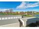 View of parking and storage units near a pond at 690 S Alton Way # 1C, Denver, CO 80247