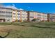 Front view of the building, showcasing its architecture and landscaping at 690 S Alton Way # 1C, Denver, CO 80247
