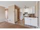 Bright eat-in kitchen with white cabinets and wood countertops at 690 S Alton Way # 1C, Denver, CO 80247