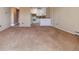 Carpeted living room with open floor plan at 690 S Alton Way # 1C, Denver, CO 80247