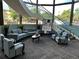 Community room with comfortable seating, a curved staircase, and large windows at 690 S Alton Way # 1C, Denver, CO 80247
