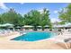 Inviting outdoor pool with plenty of lounge chairs and umbrellas at 690 S Alton Way # 1C, Denver, CO 80247