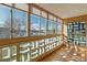 Sunroom with expansive windows, offering views of the outdoors at 690 S Alton Way # 1C, Denver, CO 80247