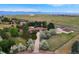 Aerial view of house, detached garage, and expansive property with mountain views at 3081 W 151St Ct, Broomfield, CO 80023