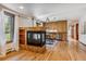 Open concept kitchen and living area with hardwood floors at 3081 W 151St Ct, Broomfield, CO 80023