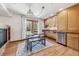 Modern kitchen with light wood cabinets and stainless steel appliances at 3081 W 151St Ct, Broomfield, CO 80023