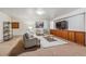 Bright and airy basement living area with built-in cabinets at 3081 W 151St Ct, Broomfield, CO 80023