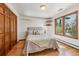 Comfortable bedroom with wood floors and built-in closet at 3081 W 151St Ct, Broomfield, CO 80023