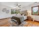 Spacious bedroom with wood floors and a ceiling fan at 3081 W 151St Ct, Broomfield, CO 80023
