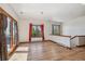 Bright bonus room with hardwood floors, large windows, and access to deck at 3081 W 151St Ct, Broomfield, CO 80023