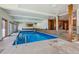 Indoor pool with large windows and wooden accents at 3081 W 151St Ct, Broomfield, CO 80023