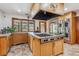 Island kitchen with stainless steel appliances and large gas range at 3081 W 151St Ct, Broomfield, CO 80023