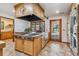 Modern kitchen with a large island, stainless steel appliances, and ample counter space at 3081 W 151St Ct, Broomfield, CO 80023