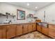 Kitchen features stainless steel farmhouse sink and custom cabinetry at 3081 W 151St Ct, Broomfield, CO 80023