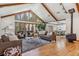 Spacious living room with hardwood floors, high ceilings, and a cozy fireplace at 3081 W 151St Ct, Broomfield, CO 80023