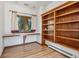 Home office with built-in wooden shelves and a window view at 3081 W 151St Ct, Broomfield, CO 80023
