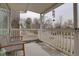 Covered porch features slate flooring and white railing at 711 S Mariposa Way, Denver, CO 80223