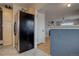 Kitchen features stainless steel refrigerator, wood cabinets, and granite countertops at 711 S Mariposa Way, Denver, CO 80223