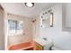 Clean bathroom with pink tub, shower, and a vanity with mirror at 4768 S Galapago St, Englewood, CO 80110