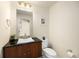 Modern bathroom with dark vanity and contemporary fixtures at 2001 Lincoln St # 1823, Denver, CO 80202