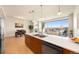 Modern kitchen with island, stainless steel appliances, and city views at 2001 Lincoln St # 1823, Denver, CO 80202