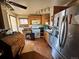 Kitchen with stainless steel appliances, wood cabinets, and wood floors at 7977 Durango St, Denver, CO 80221