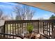 Private balcony with treetop views and seating area at 7525 W 62Nd Ave # 11, Arvada, CO 80003