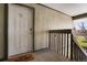 Apartment entryway with white door and a welcome mat at 7525 W 62Nd Ave # 11, Arvada, CO 80003