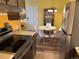 Kitchen with stainless steel appliances and adjacent dining area at 7525 W 62Nd Ave # 11, Arvada, CO 80003