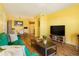 Open living room, dining area, and kitchen with wood floors at 7525 W 62Nd Ave # 11, Arvada, CO 80003