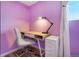 Small study area with a desk, chair, and file cabinet in a purple room at 7525 W 62Nd Ave # 11, Arvada, CO 80003