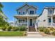 Two-story craftsman home with front porch and landscaping at 12855 Park Creek Way, Firestone, CO 80504