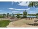 Community playground with play structures and lake views at 12855 Park Creek Way, Firestone, CO 80504