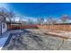 Large backyard with patio, gravel, and wooden deck at 5227 Quay Ct, Arvada, CO 80002