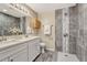 Modern bathroom with double vanity and walk-in shower at 5227 Quay Ct, Arvada, CO 80002