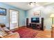 Cozy living room featuring hardwood floors, a TV, and a comfortable couch at 4720 W 37Th Ave # 29, Denver, CO 80212