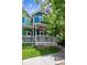 Two story house with blue and green exterior at 4720 W 37Th Ave # 29, Denver, CO 80212