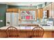 Kitchen features wood cabinets, stainless steel appliances, and a breakfast bar at 4720 W 37Th Ave # 29, Denver, CO 80212