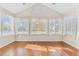 Sunroom featuring hardwood floors and abundant natural light at 2437 Santa Fe Dr # A, Longmont, CO 80504