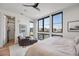 Bright bedroom with access to balcony and city views at 4214 E 8Th Pl, Denver, CO 80220