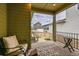 Cozy covered patio overlooking a fenced backyard at 8911 Eagle River St, Littleton, CO 80125