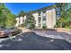 Side view of building showcasing parking and landscaping at 2160 S Vaughn Way # 304C, Aurora, CO 80014
