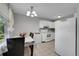 Cozy kitchen with white cabinetry, refrigerator, and dining area at 2160 S Vaughn Way # 304C, Aurora, CO 80014