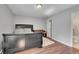 Main bedroom with dark wood platform bed and wood floors at 2160 S Vaughn Way # 304C, Aurora, CO 80014